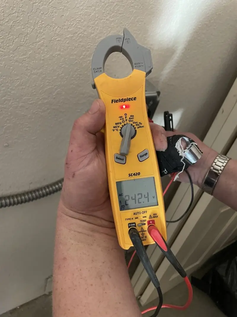 Voltage testing with clamp meter during Whole House Surge Protector in Kronenwetter